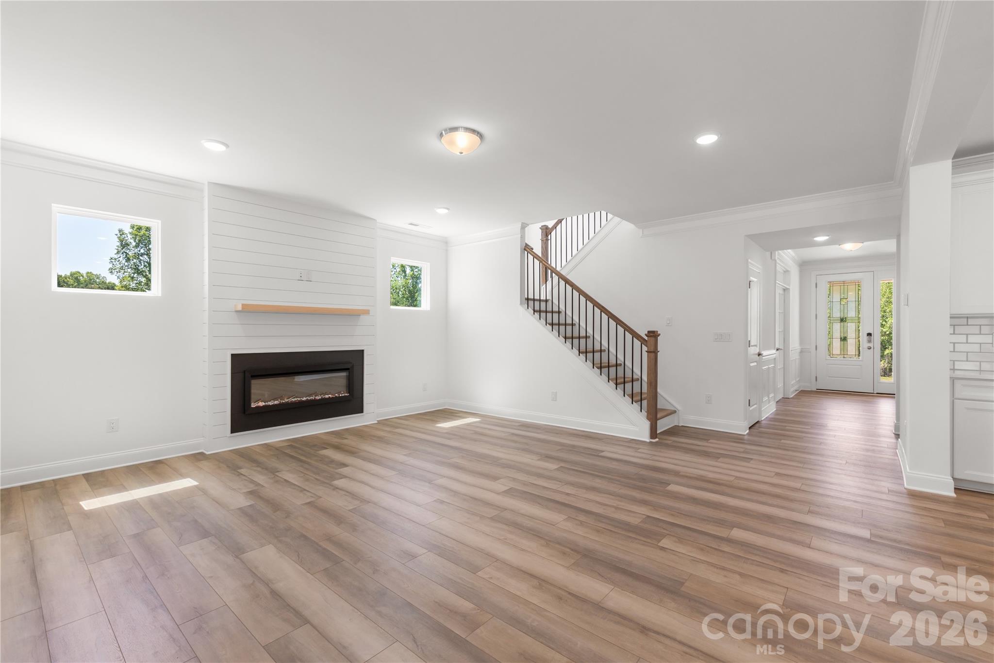 5944 Bakers Point Hickory, NC 28602 - Photo 7 of 39 a view of empty room with wooden floor and fireplace