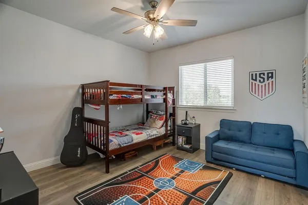 a bedroom with furniture and a window