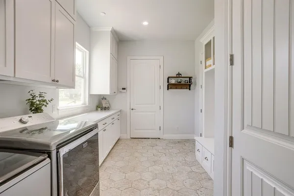 a spacious bathroom with a granite countertop sink a toilet and shower