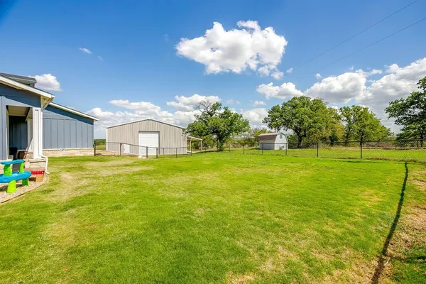 a view of a house with a big yard