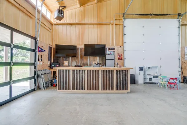 a view of balcony with furniture and a garage