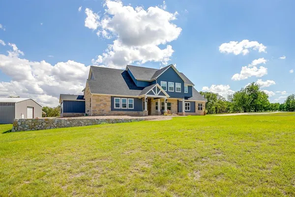 a view of a house with a big yard