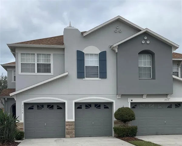 a front view of a house with garage