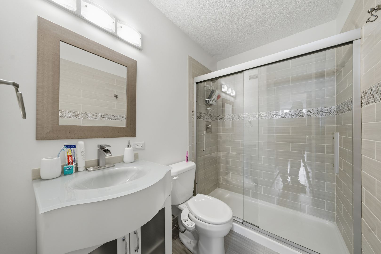 2728 North Hampden Court, Unit 605 Chicago, IL 60614 - Photo 9 of 19 a bathroom with a sink toilet and shower