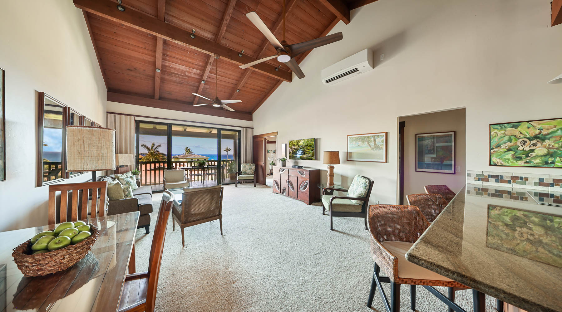 1870 Hoone Road, Unit 522 Koloa, HI 96756 - Photo 3 of 19 a living room with lots of furniture and a chandelier
