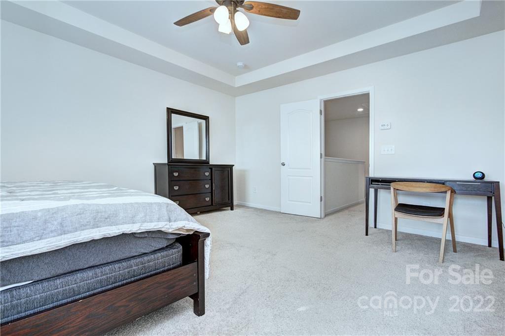 7006 Swamp Chestnut Lane Indian Land, SC 29707 - Photo 15 of 25 a bedroom with a bed and a dresser