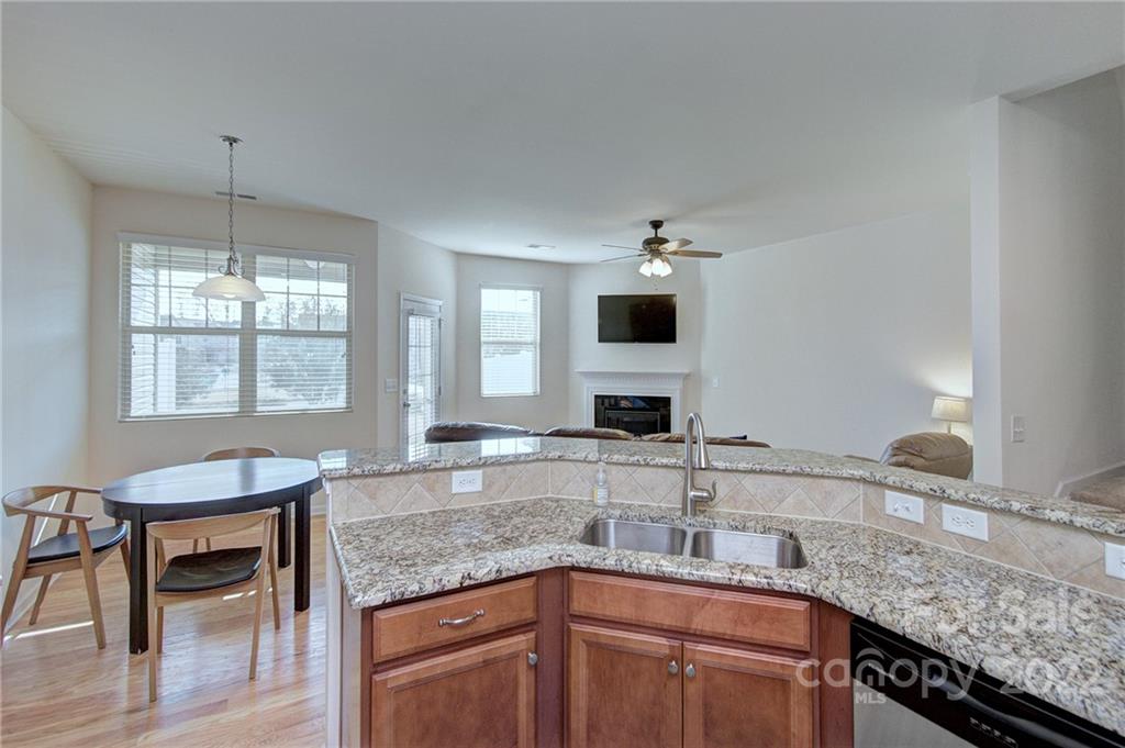 7006 Swamp Chestnut Lane Indian Land, SC 29707 - Photo 5 of 25 a kitchen with granite countertop a sink and a stove