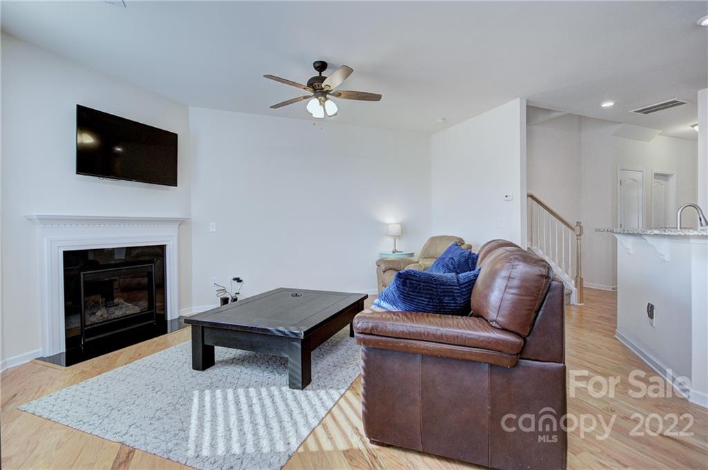 7006 Swamp Chestnut Lane Indian Land, SC 29707 - Photo 10 of 25 a living room with furniture and a fireplace