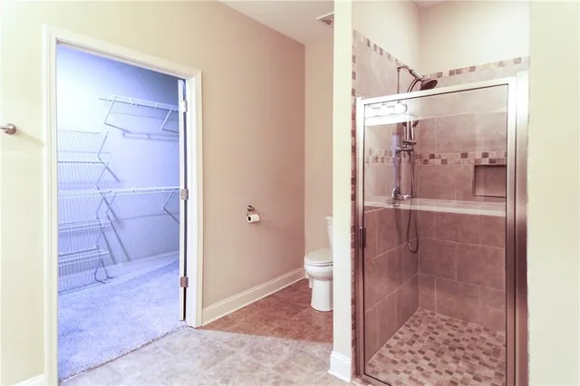a bathroom with a glass shower door