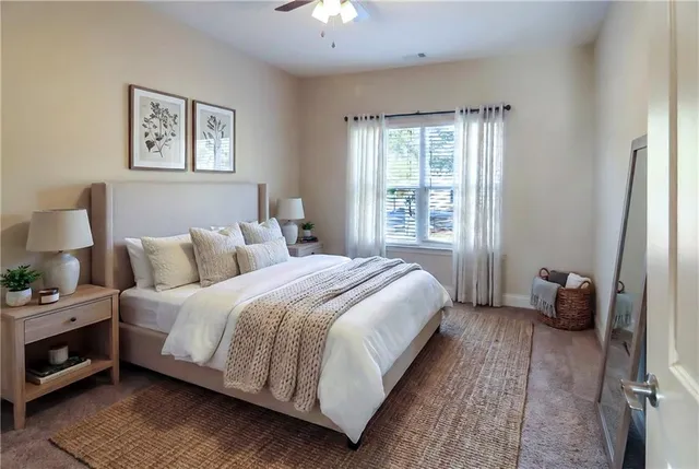 a bedroom with a bed and a window