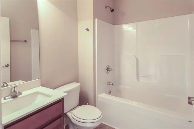 a bathroom with a sink a toilet and a bathtub