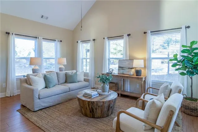 a living room with furniture and a large window