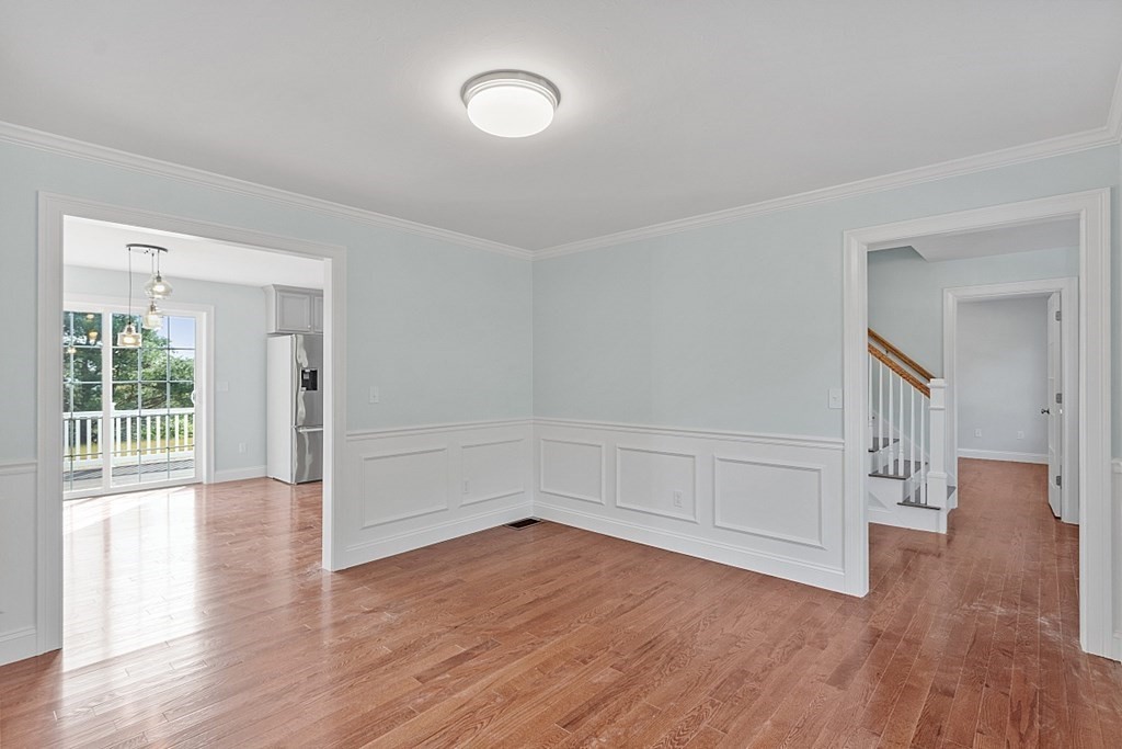 8 Worcester Road, Unit LOT 1 Westminster, MA 01473 - Photo 11 of 38 a view of empty room with wooden floor and fan