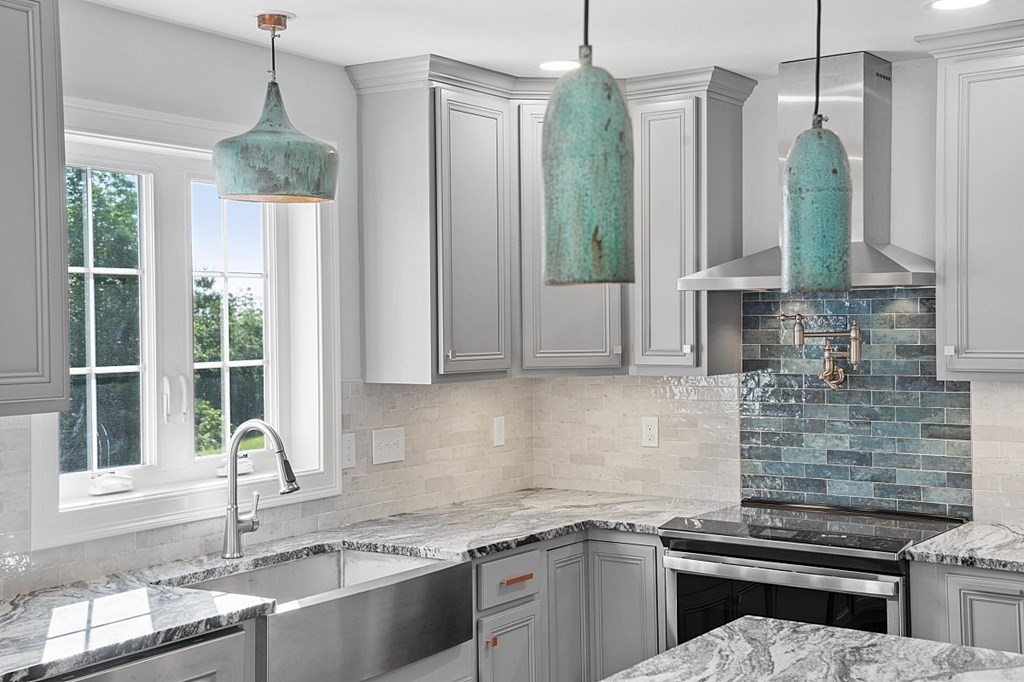 8 Worcester Road, Unit LOT 1 Westminster, MA 01473 - Photo 14 of 38 a kitchen with stainless steel appliances granite countertop a sink a counter space and a window