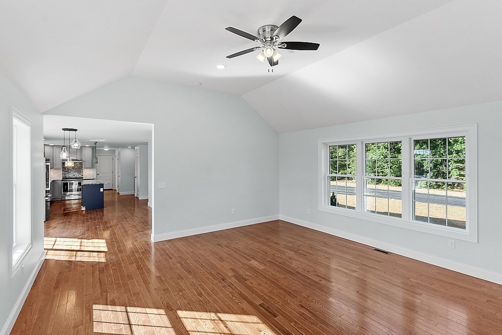 8 Worcester Road, Unit LOT 1 Westminster, MA 01473 - Photo 21 of 38 a view of a livingroom with wooden floor and a ceiling fan