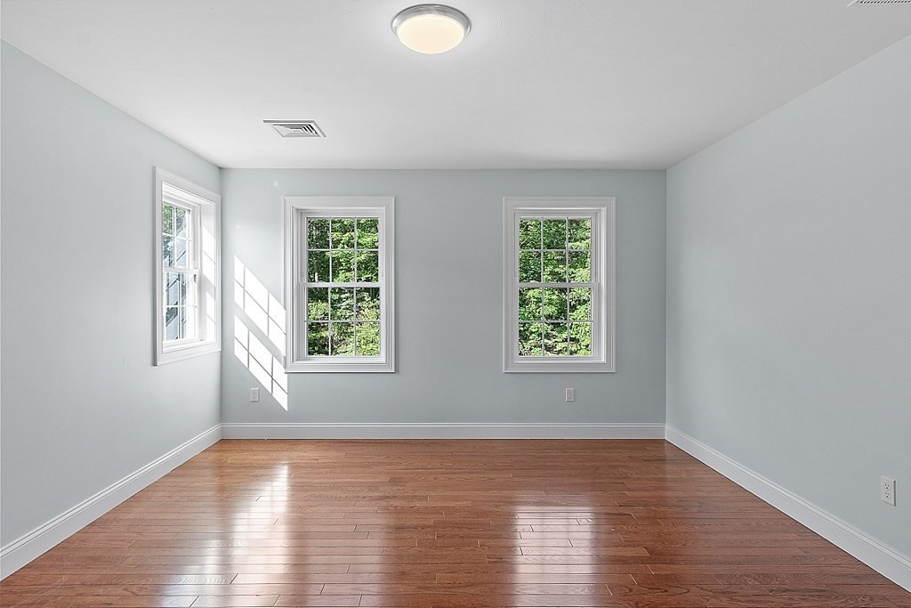 8 Worcester Road, Unit LOT 1 Westminster, MA 01473 - Photo 24 of 38 an empty room with wooden floor and windows