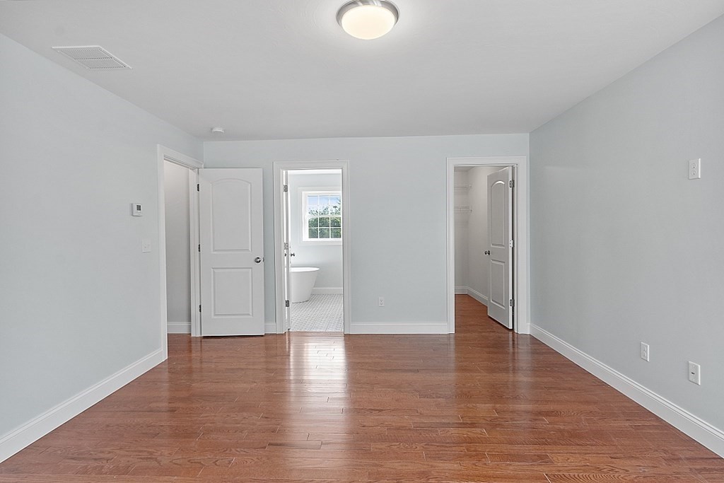 8 Worcester Road, Unit LOT 1 Westminster, MA 01473 - Photo 25 of 38 a view of an empty room with wooden floor and windows