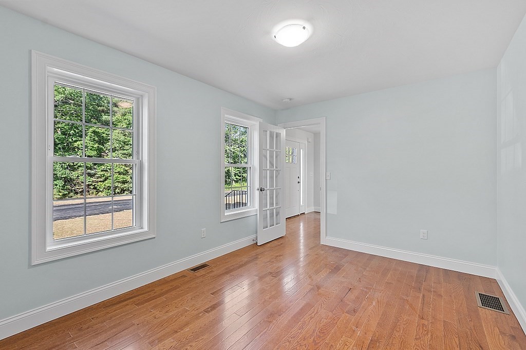 8 Worcester Road, Unit LOT 1 Westminster, MA 01473 - Photo 8 of 38 an empty room with wooden floor and windows