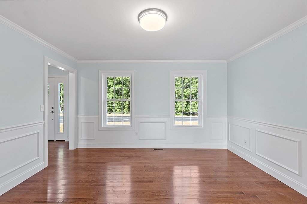 8 Worcester Road, Unit LOT 1 Westminster, MA 01473 - Photo 10 of 38 an empty room with wooden floor and windows