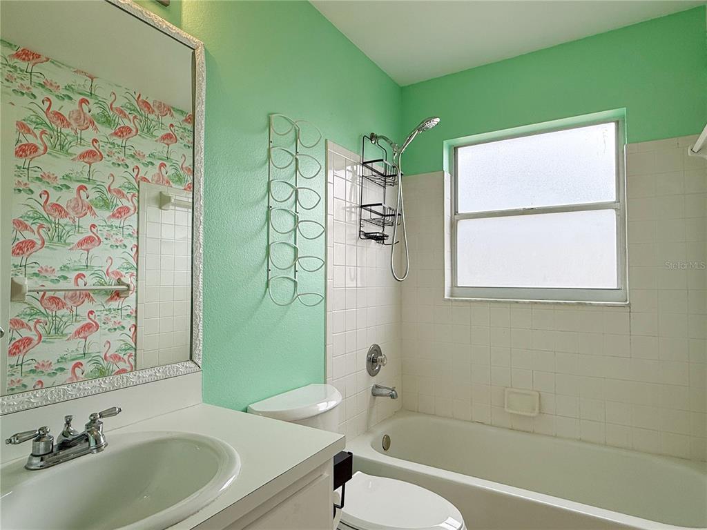 132 Robins Rest Circle Davenport, FL 33896 - Photo 18 of 35 a bathroom with a sink a toilet and shower