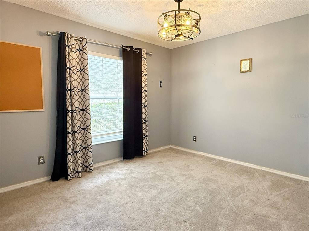 132 Robins Rest Circle Davenport, FL 33896 - Photo 22 of 35 en view of an empty room with a window