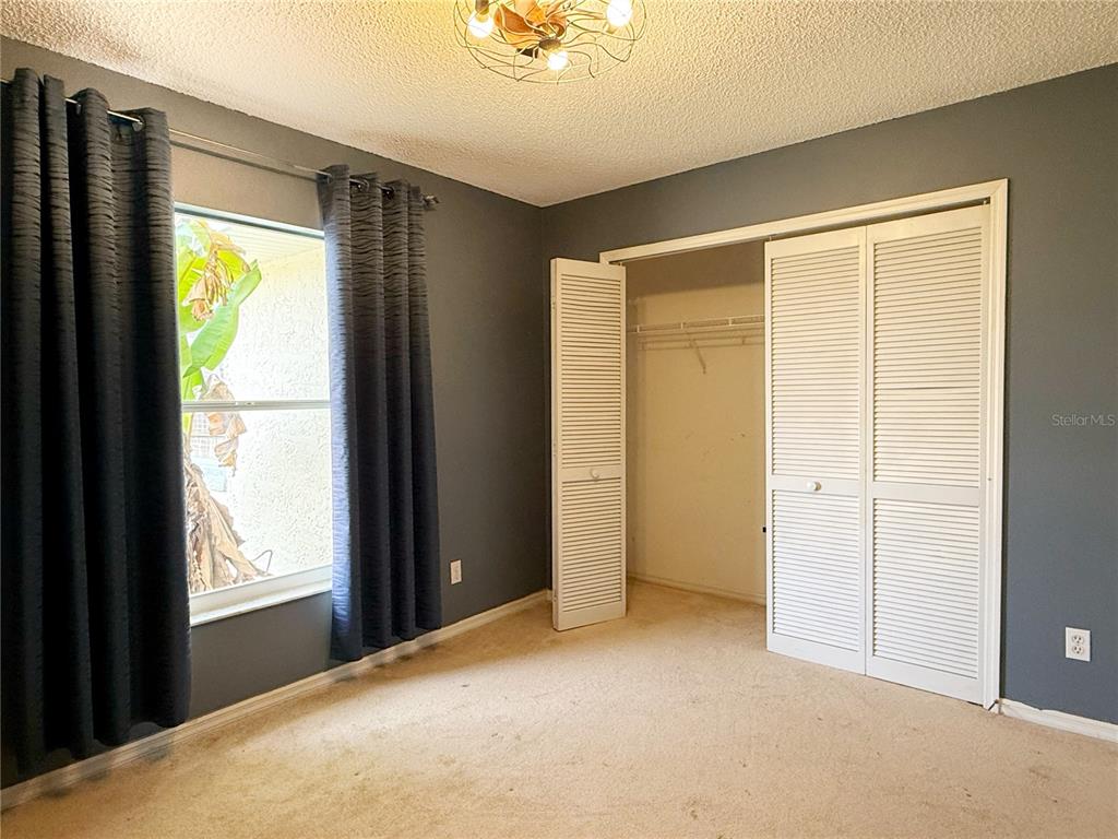 132 Robins Rest Circle Davenport, FL 33896 - Photo 23 of 35 a view of an empty room with a window