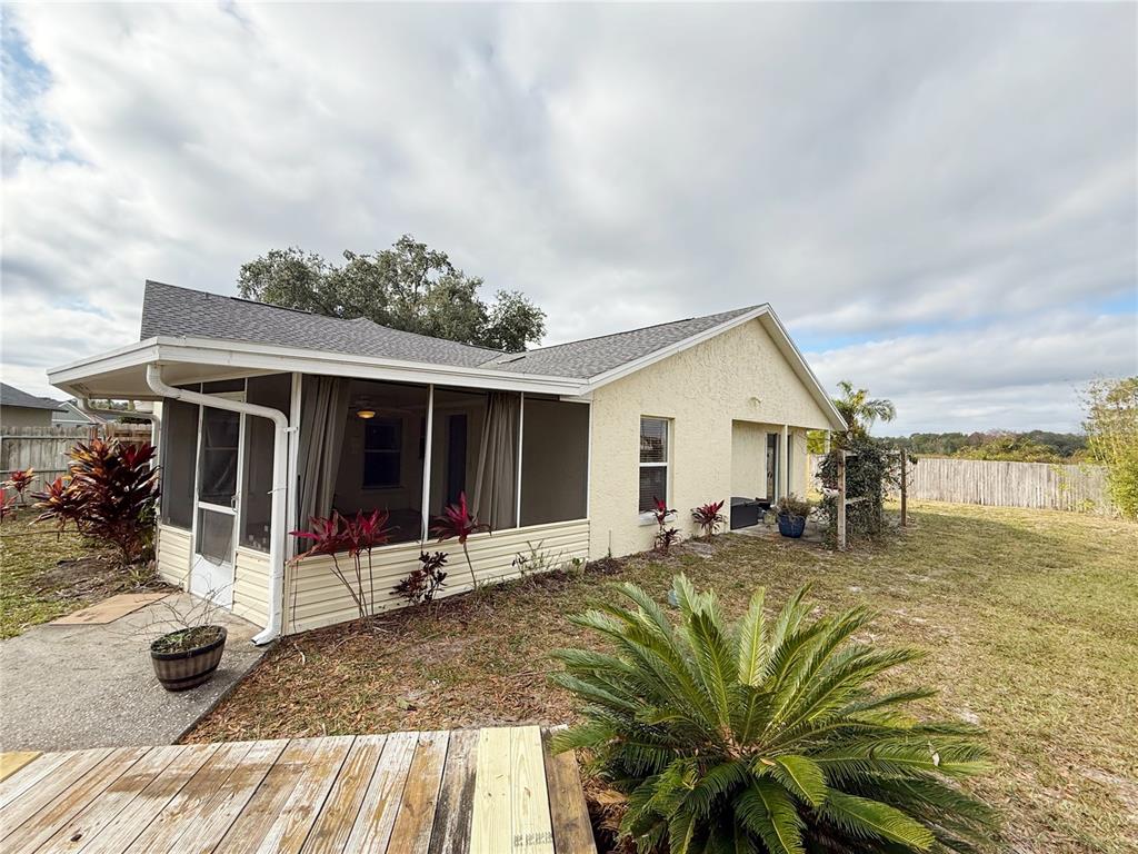 132 Robins Rest Circle Davenport, FL 33896 - Photo 33 of 35 a front view of house with yard outdoor seating and barbeque oven