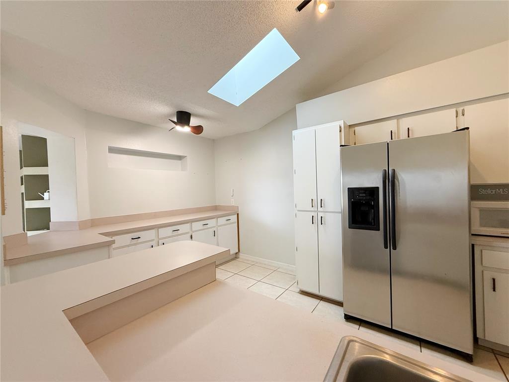 132 Robins Rest Circle Davenport, FL 33896 - Photo 10 of 35 a view of a kitchen with a stove