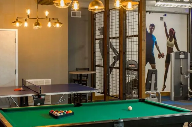 a view of an chairs and table in front of house