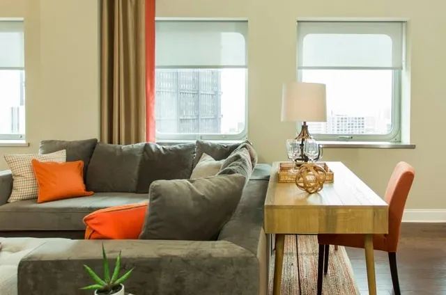 a living room with furniture and a window