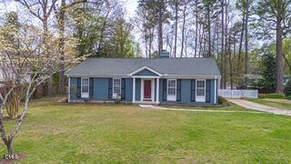 408 Ortega Road Raleigh, NC 27609 - Photo 1 of 25 front view of a house with a big yard