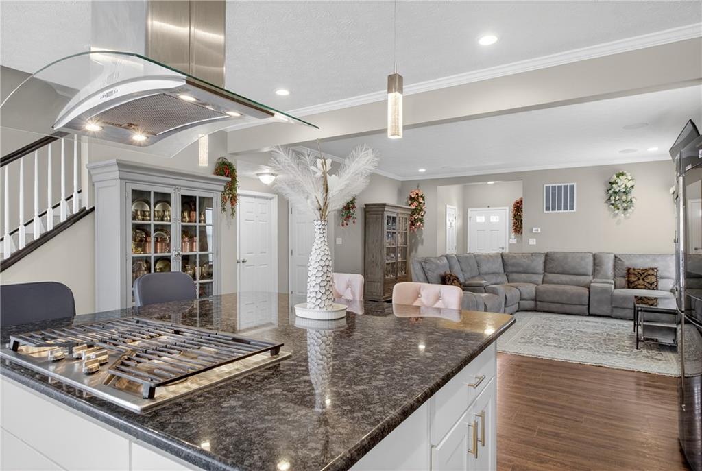 423 Labrador Lane Clairton, PA 15025 - Photo 12 of 49 a kitchen with stainless steel appliances granite countertop a sink counter space and wooden floor
