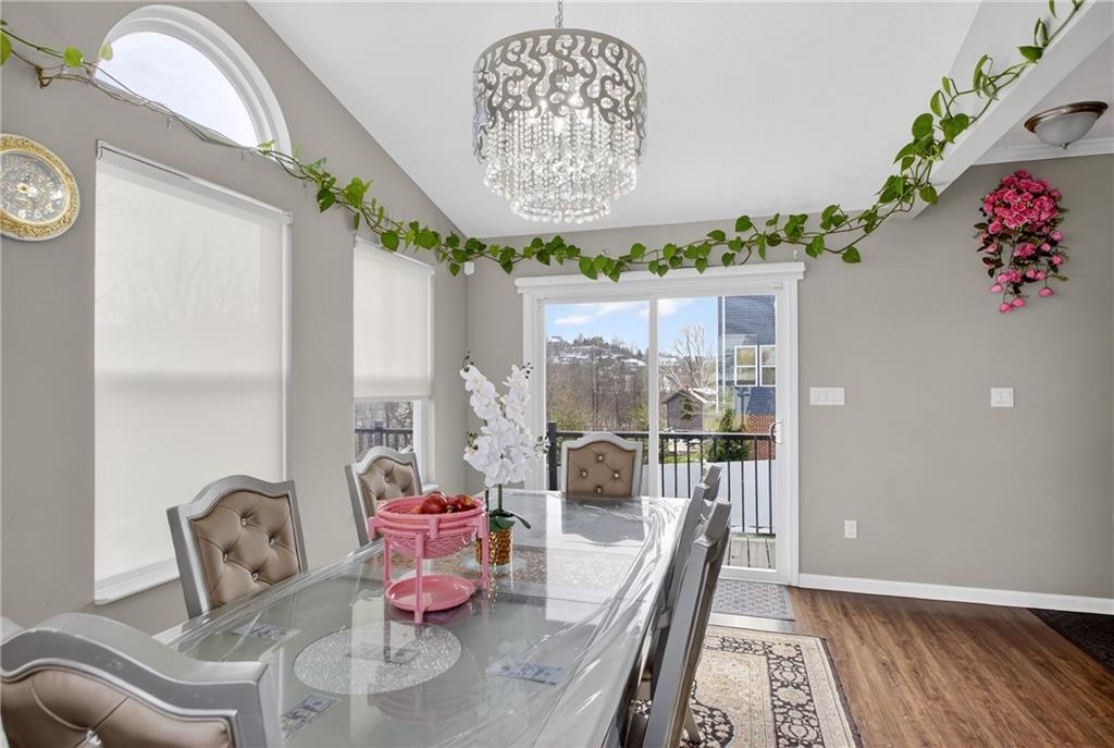 423 Labrador Lane Clairton, PA 15025 - Photo 19 of 49 a dining room with furniture a rug and a chandelier