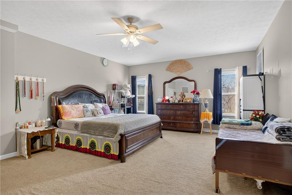 423 Labrador Lane Clairton, PA 15025 - Photo 21 of 49 a bedroom with a bed a couch and dresser