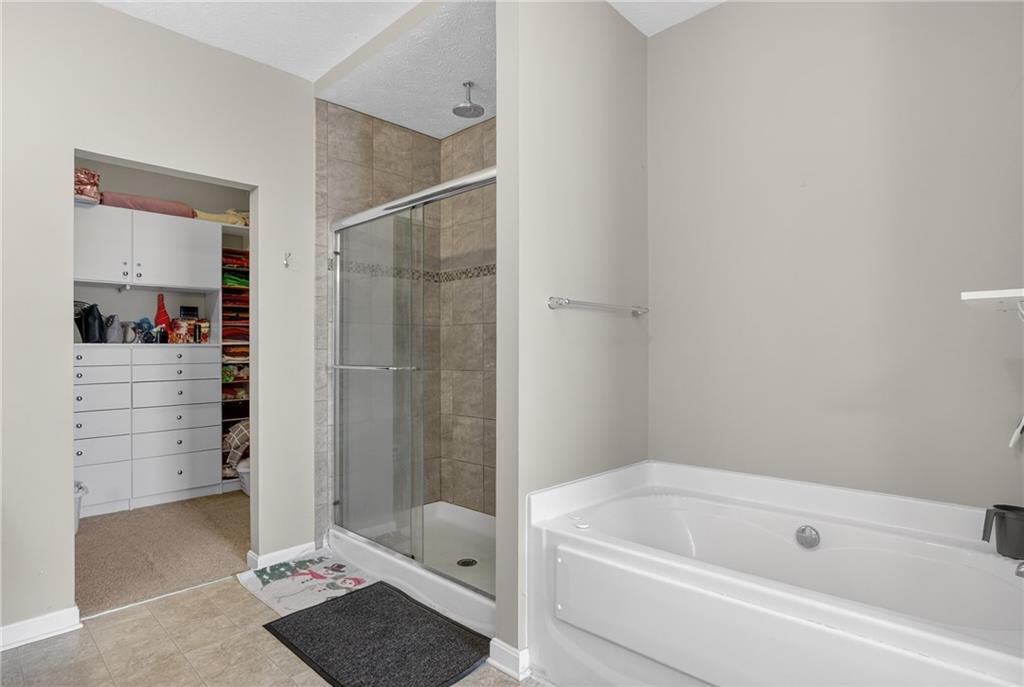 423 Labrador Lane Clairton, PA 15025 - Photo 27 of 49 a bathroom with a bathtub and a shower