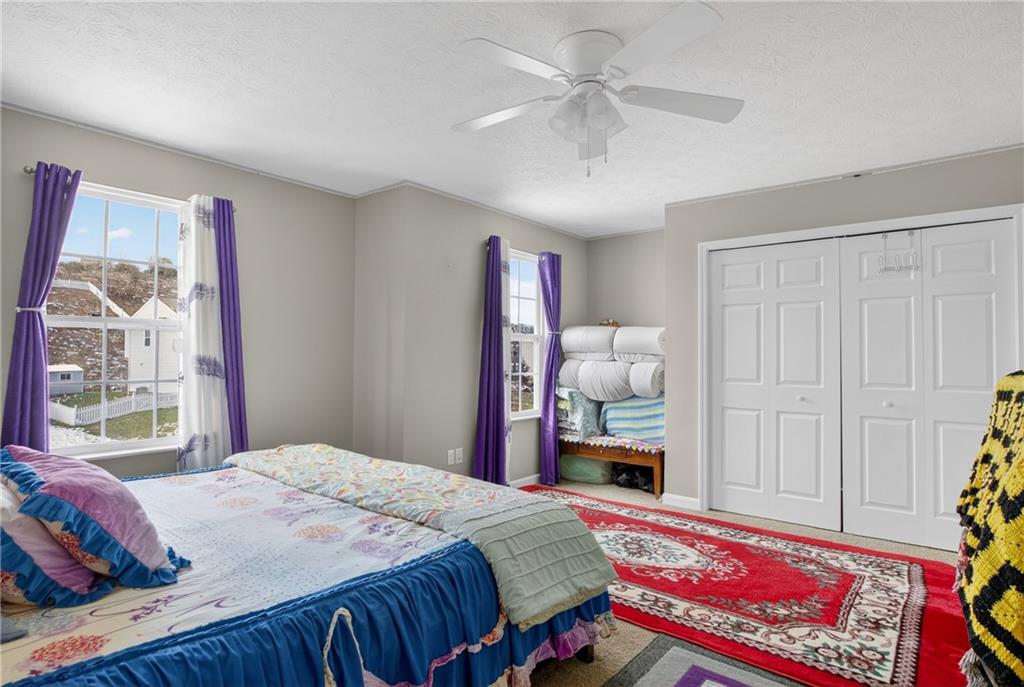 423 Labrador Lane Clairton, PA 15025 - Photo 32 of 49 a bedroom with a bed and a window