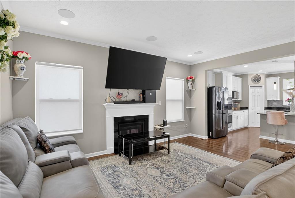 423 Labrador Lane Clairton, PA 15025 - Photo 4 of 49 a living room with furniture a fireplace and a flat screen tv