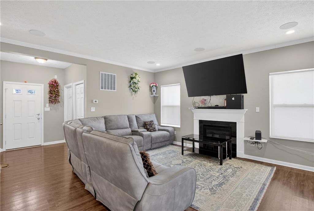423 Labrador Lane Clairton, PA 15025 - Photo 5 of 49 a living room with furniture a fireplace and a flat screen tv