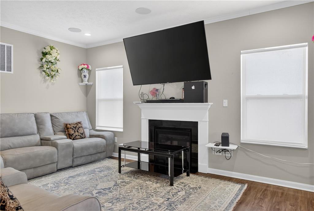 423 Labrador Lane Clairton, PA 15025 - Photo 7 of 49 a living room with furniture a fireplace and a flat screen tv