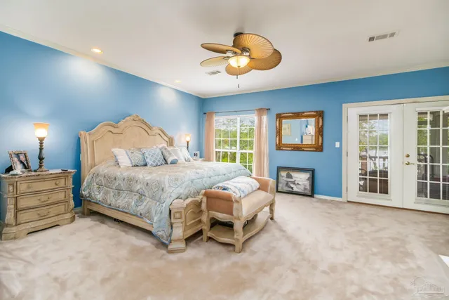 a bedroom with a bed and a fireplace