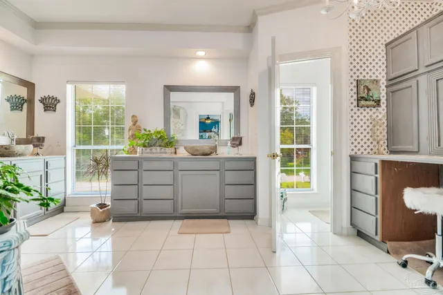 a kitchen with a sink and cabinets