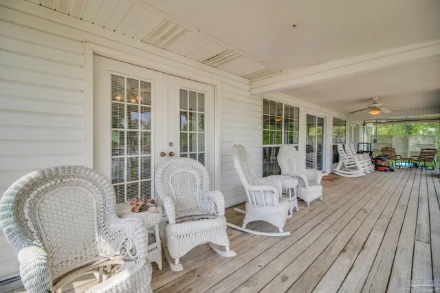 a view of a chair and table in the balcony