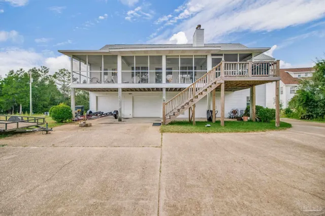 a view of balcony with wooden floor and seating space