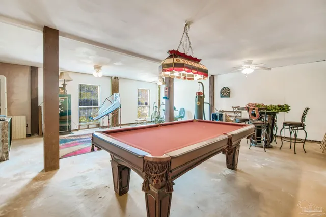 a bed room with furniture and a wooden floor