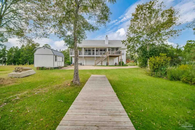 a view of swimming pool with seating area and furniture