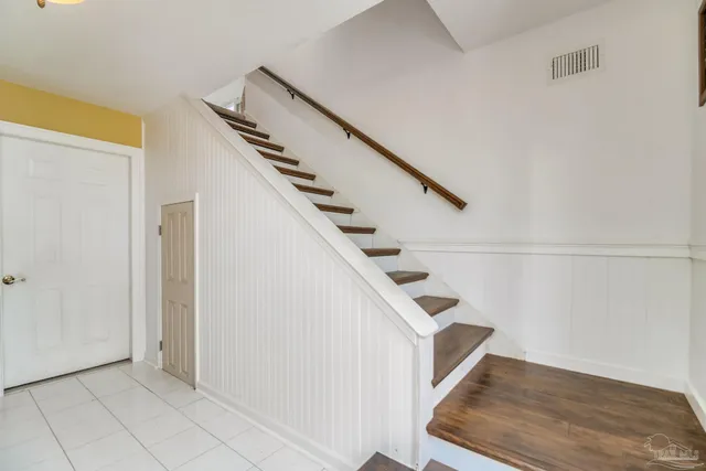 a living room with furniture fireplace and flat screen tv
