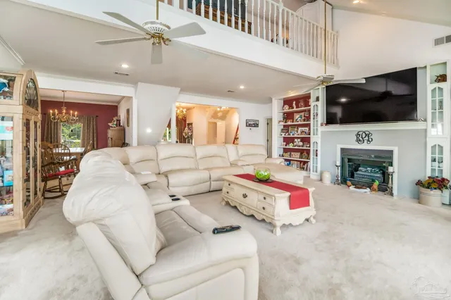 a living room with furniture and white walls