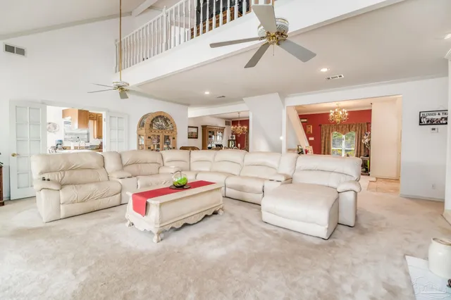 a kitchen with a sink a refrigerator and cabinets
