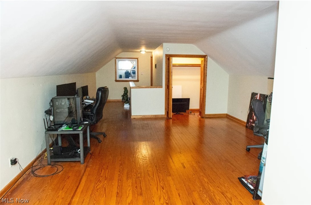 6714 Trenholm Road Youngstown, OH 44512 - Photo 12 of 22 Home office featuring vaulted ceiling and hardwood / wood-style floors