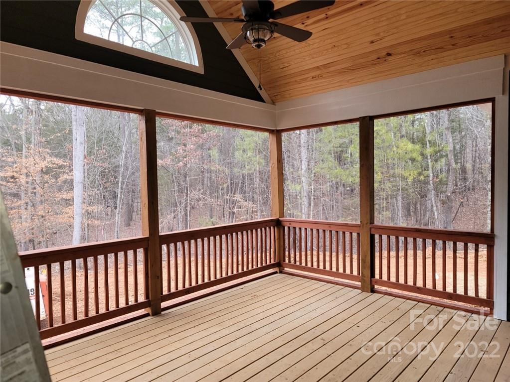 1152 Blacksnake Road Stanley, NC 28164 - Photo 14 of 15 a view of a porch with wooden floor